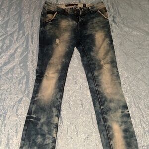 Distressed faded blue jeans